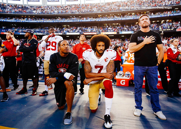 Colin Kaepernick kneeling during national anthem photo credit Michael Zagaris San Francisco 49ers Getty Images 750x489