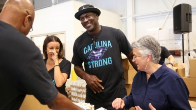 Charlotte Hornets chairman Michael Jordan helping volunteers serve North Carolina residents uprooted by Hurricane Florence