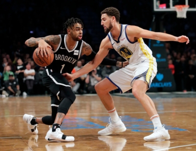 Brooklyn Nets guard D’Angelo Russell pushing past Golden State Warriors guard Klay Thompson at the Barclays Center on Sunday, October 28, 2018.