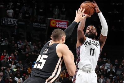 Kyrie Irving, Brooklyn Nets point guard, scores over Atlanta Hawks center Alex Len, and leads the Brooklyn Nets to a 108-86 victory on Sunday, January 12, 2020, at the Barclays Center in Brooklyn, NY.