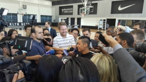 Brooklyn Nets guard Jeremy Lin surrounded by reporters