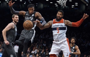  Photo  Rondae Hollis-Jefferson, Brooklyn Nets forward (center), competes for the ball with Washington Wizards&#039; forward Markieff Morris (right) during the first half of an NBA basketball game Friday, Dec. 22, 2017, at the Barclays Center in Brooklyn, NY. 