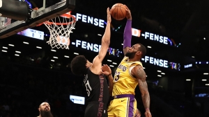Brooklyn Nets center Jarrett Allen (left) makes history blocking a dunk by Los Angeles Lakers forward LeBron James, only one of eight NBA players to do so in 1,850 dunk attempts.  
