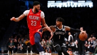 Brooklyn Nets guard D'Angelo Russell pushing past New Orleans Pelicans forward Anthony Davis (23) at a game at the Barclays Center on January 2, 2019.