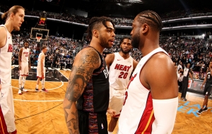Brooklyn Nets guard D’Angelo Russell (left) talking with Miami Heat guard Dwyane Wade on the court at the Barclays Center in Brooklyn, NY. Brooklyn Nets defeats Miami Heat 113-94 on the last day of Dwyane Wade’s career as an NBA basketball player.  