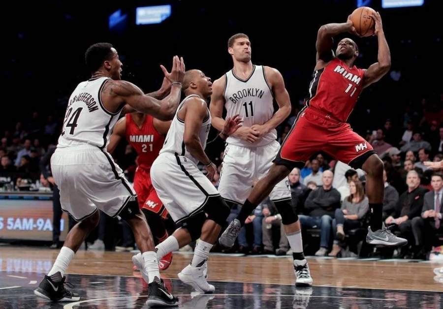 Miami Heat guard Dion Waiters (11) is shooting around Brooklyn Nets players in second quarter during NBA game at Barclays Center in Brooklyn on January 25, 2017