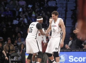 Trevor Booker and Brook Lopez celebrate as Brooklyn Nets cruise by the Orlando Magic 121-111 on April 1, 2017. No April Fools&#039; joke.
