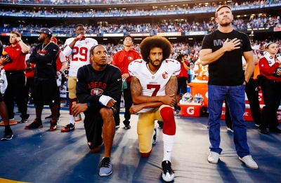 Colin Kaepernick kneeling during the National Anthem prior to a San Francisco 49ers game