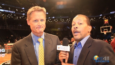 Golden State Warriors head coach Steve Kerr talking with What’s The 411Sports correspondent Andrew Rosario prior to the first game between the Brooklyn Nets and the New York Knicks at the Barclays Center in Brooklyn.